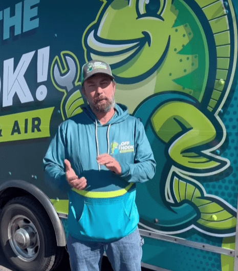 Off The Hook Heating & Air owner advising on furnace repair and maintenance in Zimmerman